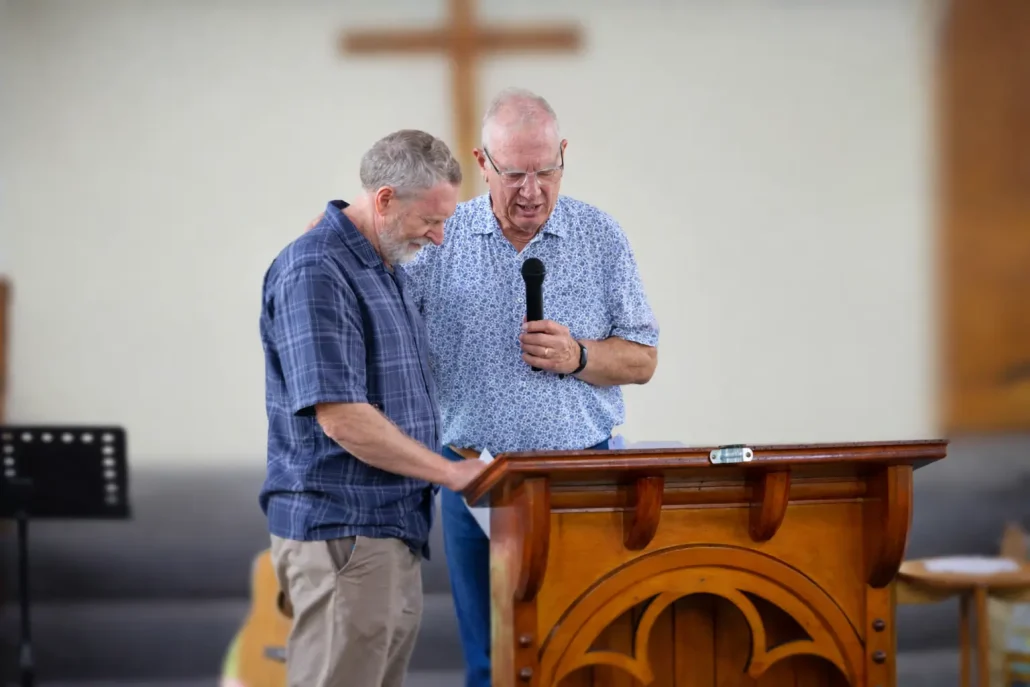 Praying at the pulpit together